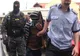 Doi bărbaţi acuzaţi de omor în cazul poliţistului împuşcat