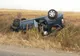 Autoturism răsturnat la Suseni. O șoferiță de 70 de ani a ajuns cu mașina pe câmp