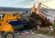 Un tren de călători a lovit un camion care transporta 70 de stupi de albine
